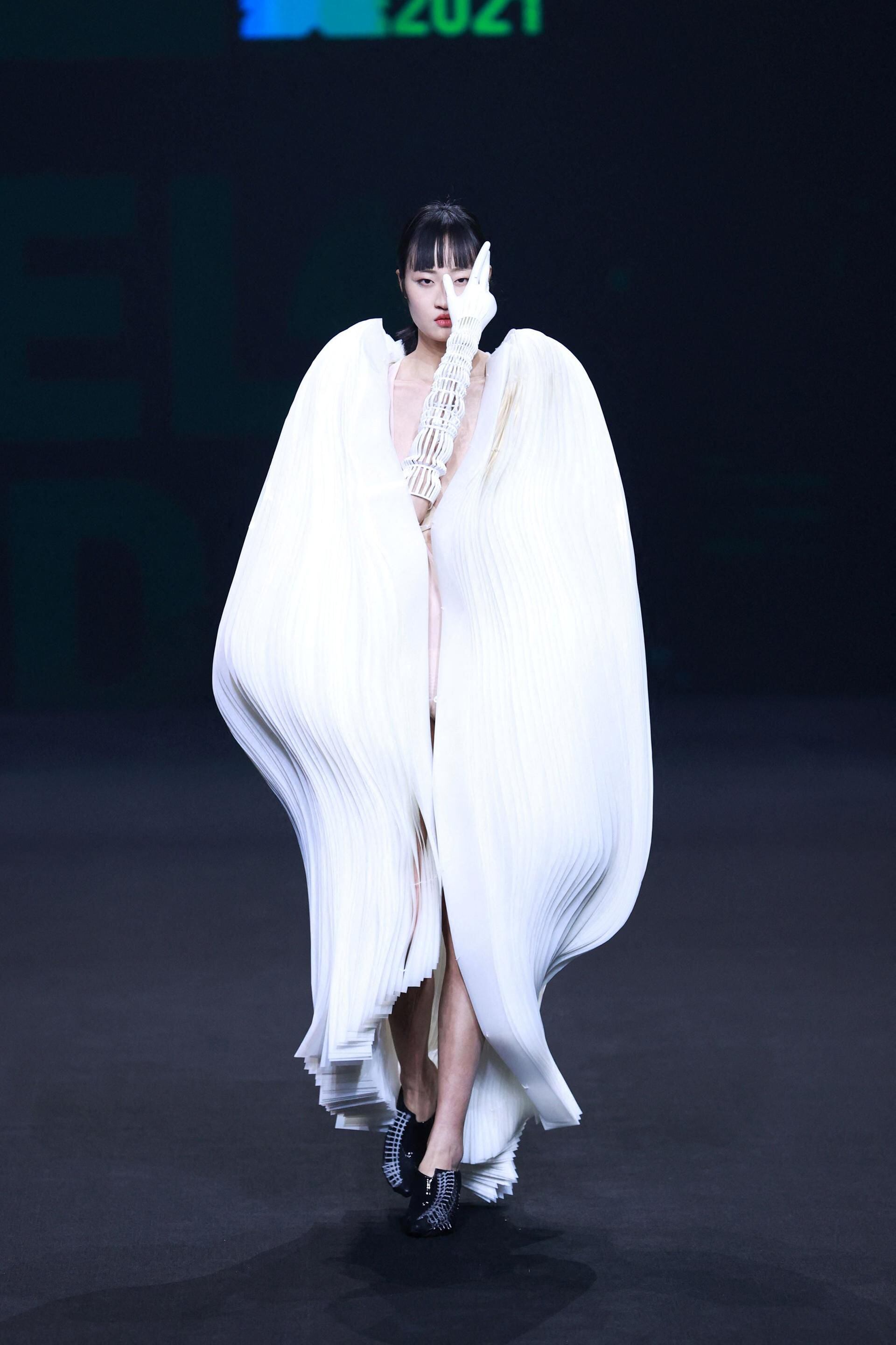 A model walks the runway during the Esa Liang show by BingQin Liang News  Photo - Getty Images