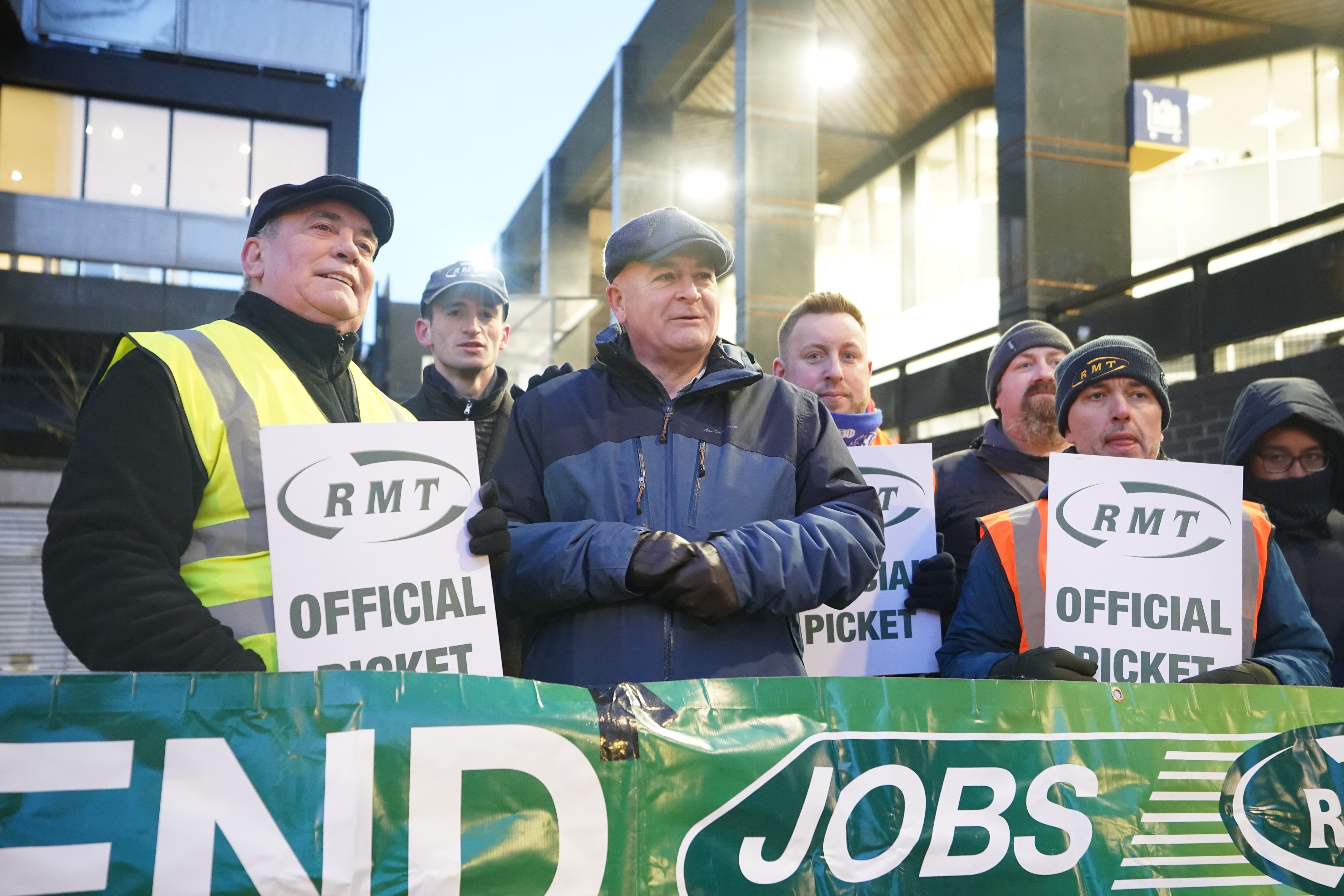 Striking hospital workers turn up at RMT rally in show of support for rail  staff