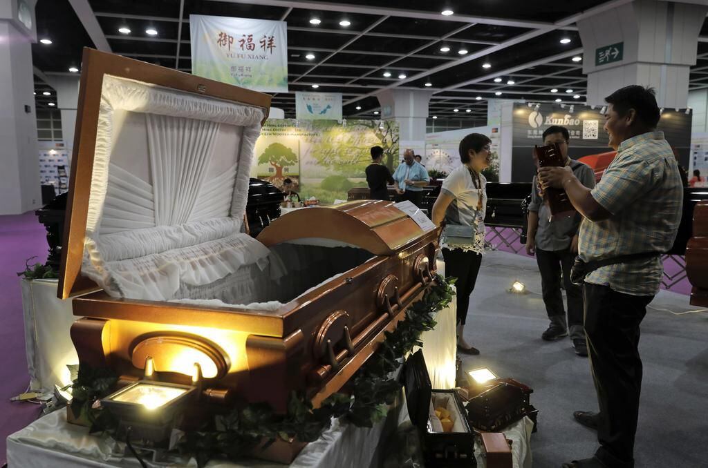 At Hong Kong death expo, Asian funerals go from green to hightech