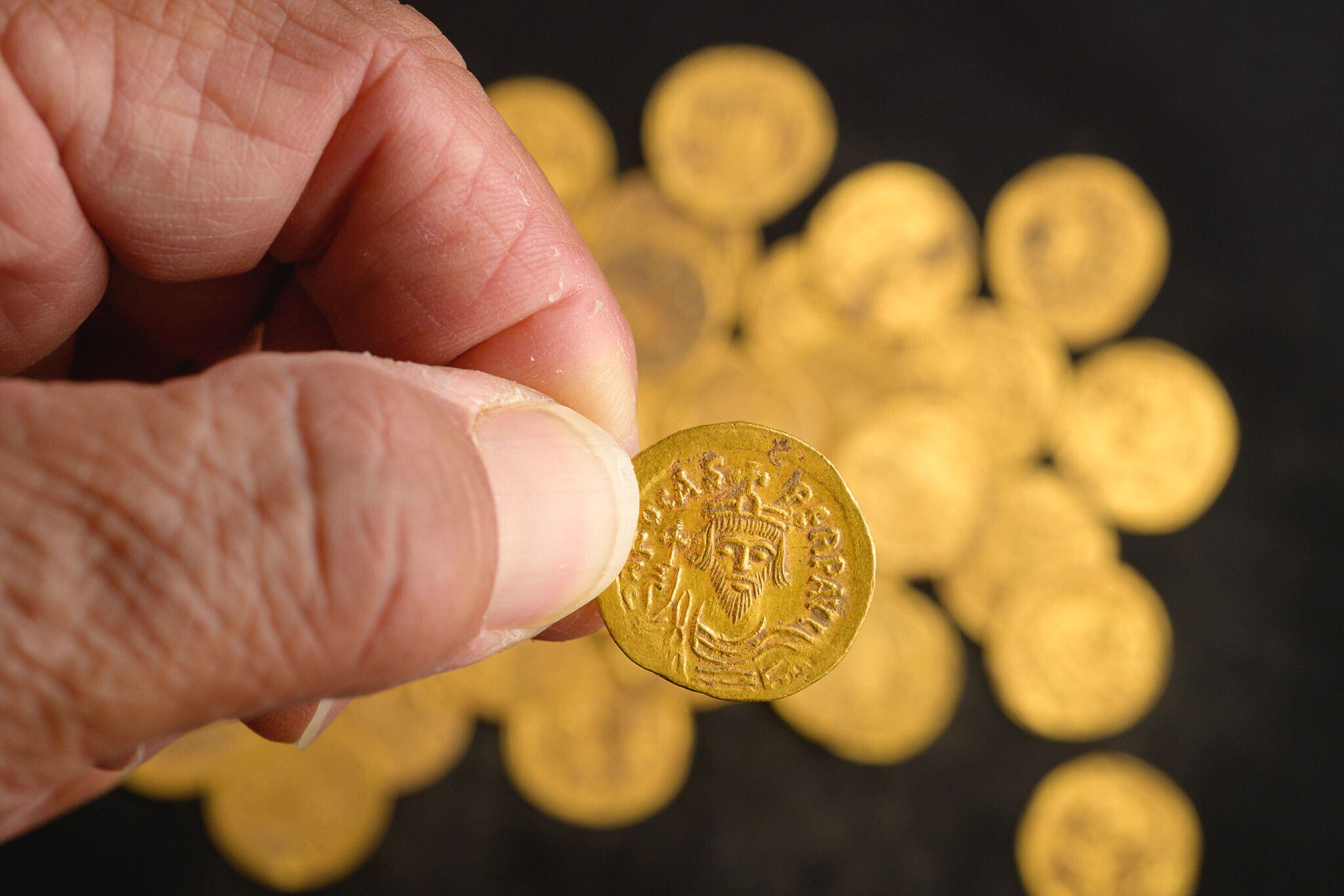 Dozens of 7th century gold coins found in ancient wall by Israeli  archaeologists