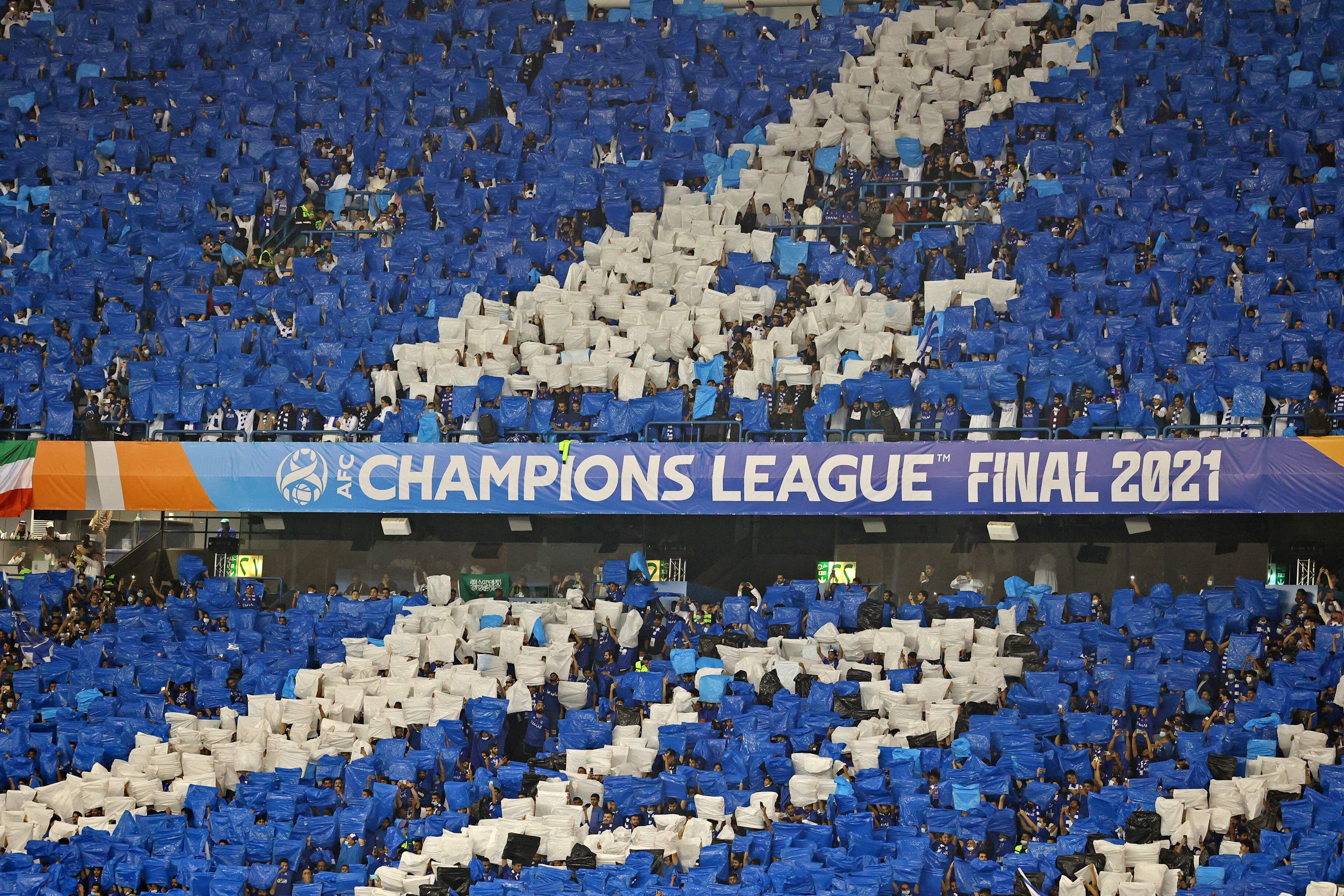 Saudi Arabia's Al Hilal soccer team players celebrate their trophy of the  AFC Champions League 2021 after the team beats South Korea's Pohang  Steelers 2-0 during their final soccermatch at the King